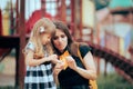 Mom Applying a Plaster on an Injured Daughter at the Playground Royalty Free Stock Photo