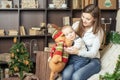 Mom with baby holding toy of big elk! Royalty Free Stock Photo