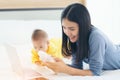 Mom and baby with laptop computer working from home Royalty Free Stock Photo