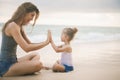 Mom and baby playing near beach. Traveling with family, child Royalty Free Stock Photo