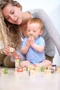 Mom, Baby And Playing With Wooden Blocks Or Toys For Childhood Development Or Bonding At Home. Mother, Toddler And