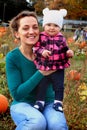 Mom and Baby in pumpkin patch