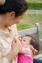 Mom breast feeding her baby girl Royalty Free Stock Photo