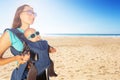 Mom carry infant baby on the sea summer beach day Royalty Free Stock Photo