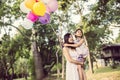 Mom carrying his daughter with nature and sunlight, enjoyment family Royalty Free Stock Photo