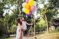 Mom carrying his daughter with nature and sunlight, enjoyment family Royalty Free Stock Photo