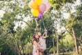 Mom carrying his daughter with nature and sunlight, enjoyment family Royalty Free Stock Photo