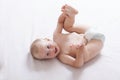 Mom changing diaper to the baby lying on his back Royalty Free Stock Photo