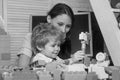 Mom and child build out of colorful plastic blocks. Royalty Free Stock Photo