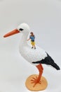 mom with child and a stork miniature figurines