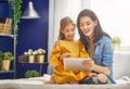 Mom and child with tablet Royalty Free Stock Photo