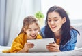 Mom and child with tablet Royalty Free Stock Photo