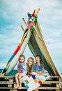 Mom with children girl in tent. Summer outdoor. Family playing together. Happy mother laughing with kids, camping Royalty Free Stock Photo