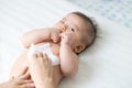 Mom cleaning up and wipe body baby by wet tissue when changing nappies or diaper and wiping the hands or face or leg Royalty Free Stock Photo