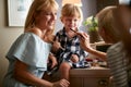 Mom with cute girl at grandma`s playing