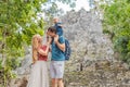Mom, dad and baby tourists at Coba, Mexico. Ancient mayan city in Mexico. Coba is an archaeological area and a famous