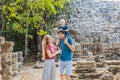 Mom, dad and baby tourists at Coba, Mexico. Ancient mayan city in Mexico. Coba is an archaeological area and a famous