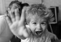 Mom, dad and boy in light room and blackboard