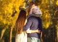 Mom and dad with daughter at sunset in the woods play