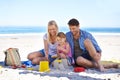 Mom, dad and girl with sandcastle at beach on vacation with care, learning and building on holiday in summer. Father Royalty Free Stock Photo