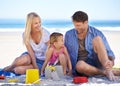 Mom, dad and girl with sandcastle by ocean on vacation with care, learning or building on holiday in summer. Father Royalty Free Stock Photo