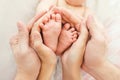 Mom and Dad hold baby legs Royalty Free Stock Photo