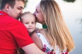 Mom and dad hold their daughter hands. Happy successful family. Royalty Free Stock Photo