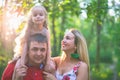 Mom and dad hold their daughter hands. Happy successful family. Royalty Free Stock Photo