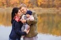 Mom and dad holding baby girl in hands Royalty Free Stock Photo