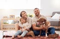 Mom, dad and portrait of kid with dog in living room for quality time, love and care together at home. Mother, father