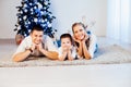 Mom dad and son decorate Christmas tree gifts new year tree winter holiday Garland Royalty Free Stock Photo