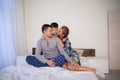 Mom dad and son in the morning in the bedroom on the bed Royalty Free Stock Photo