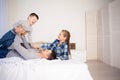 Mom dad and son in the morning in the bedroom on the bed Royalty Free Stock Photo
