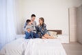 Mom dad and son in the morning lying on the bed at home in a good mood Royalty Free Stock Photo