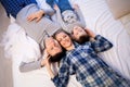 Mom dad and son in the morning lying on the bed at home in a good mood Royalty Free Stock Photo