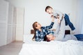 Mom dad and son in the morning lying on the bed at home in a good mood Royalty Free Stock Photo