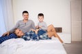 Mom dad and son in the morning lying on the bed at home in a good mood Royalty Free Stock Photo