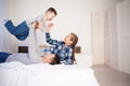 Mom dad and young son in the bedroom after sleeping House Royalty Free Stock Photo