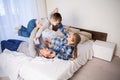 Mom dad and young son in the bedroom after sleeping House Royalty Free Stock Photo