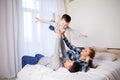 Mom dad and young son in the bedroom after sleeping House Royalty Free Stock Photo