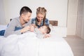 Mom dad and young son in the bedroom after sleeping House Royalty Free Stock Photo