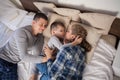 Mom dad and young son in the bedroom after sleeping House Royalty Free Stock Photo