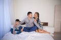 Mom dad and young son in the bedroom after sleeping House Royalty Free Stock Photo