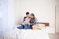 Mom dad and young son in the morning in bed after sleeping Royalty Free Stock Photo