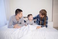 Mom dad and young son in the morning in bed after sleeping Royalty Free Stock Photo