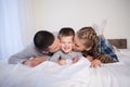 Mom dad and young son sleep on the bed in the bedroom Royalty Free Stock Photo