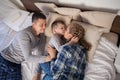 Mom dad and young son sleep on the bed in the bedroom Royalty Free Stock Photo