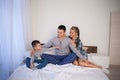 Mom dad and young son sleep on the bed in the bedroom Royalty Free Stock Photo