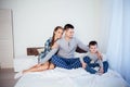 Mom dad and young son sleep on the bed in the bedroom Royalty Free Stock Photo