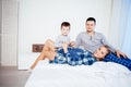 Mom dad and young son sleep on the bed in the bedroom Royalty Free Stock Photo